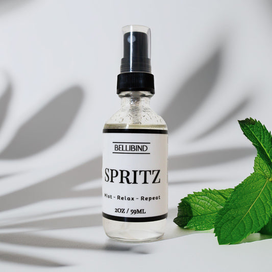 Spritz Aromatherapy Mist by Bellibind in a glass bottle with botanical ingredients.
